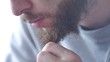 © smartbobert - Bearded man twirling his ridiculously long mustache Extreme close up shot