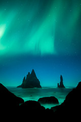 Wall Mural - Aurora Borealis (Northern Lights) above Vik rock formation, Iceland