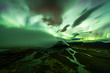 Wall Mural - aurora borealis (northern lights) above geothermal volcanic vents in hveravellir
