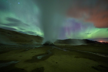 Wall Mural - Aurora Borealis (Northern Lights) above geothermal volcanic vents in Hveravellir