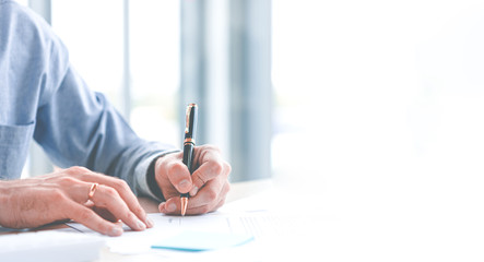 close up of hand caucasian young businessman signing a contract. about the financial business in the