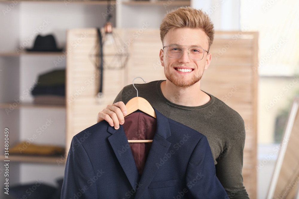 Handsome man with stylish clothes in dressing room