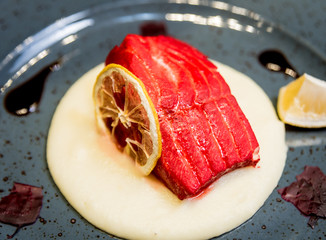 Sticker - Raw salmon fish fillet with herbs on the plate. Restaurant.