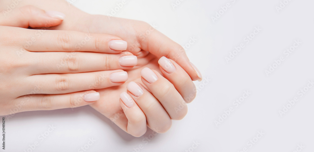 Stylish trendy nail young woman hands pink manicure on white background - obrazy, fototapety, plakaty 