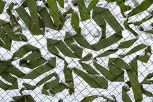 Camouflage Netting. Mesh Fence Protection Military Camouflage Background.