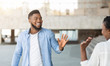 © Prostock-studio - Guy and girl waving hands, greeting each other in the street