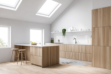 Attic white kitchen corner with bar