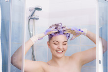 Woman Applying Toner Shampoo On Her Hair