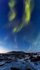 Wall Mural - Northern lights above an arctic landscape 