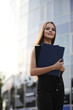 © alexkich - Girl with documents at a business meeting
