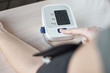 © Lazy_Bear - Woman measuring blood pressure with an electric digital tonometer.  Healthcare and medicine concept