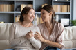 © fizkes - Smiling adult mom and daughter have fun chatting at home