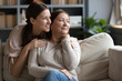 © fizkes - Smiling middle-aged mum and adult daughter dreaming together