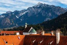 Panoramic View Of The Alps Over The Roofs Of Füssen