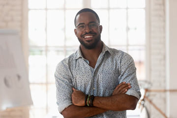 Portrait of smiling african American businessman posing in office