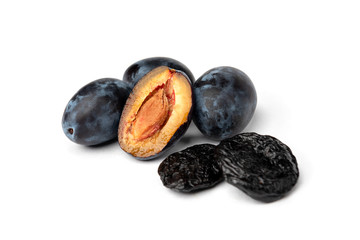 Wall Mural - Fresh plum and prune isolated on white background.