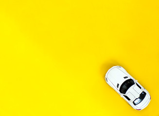 Machine on a yellow background with a copy space top view. Background with children's toys.