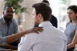 Caring woman touch man shoulder show support at group session