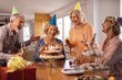 © Drazen - Group of cheerful seniors celebrating on Birthday party at home.