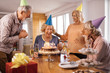 © Drazen - Group of cheerful seniors having fun on Birthday party at home.