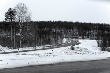 Poster - Landscape with the image of country road in Karelia at winter