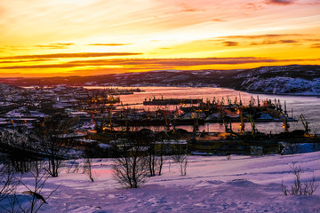 Poster - Murmansk, Russia - January, 5, 2020: Non-freezing seaport in the city of Murmansk in winter. The picture was taken at 2 p.m. in natural light at the height of a polar night