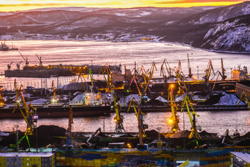 Poster - Murmansk, Russia - January, 5, 2020: Non-freezing seaport in the city of Murmansk in winter. The picture was taken at 2 p.m. in natural light at the height of a polar night