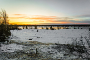 Wall Mural - Landscape with the image of the ice covered frozen river Kem in Karelia, Russia