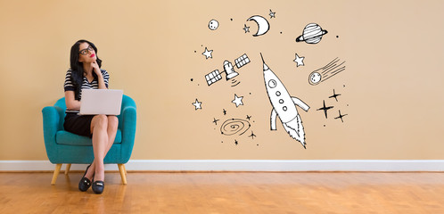 Wall Mural - Dream of space and rocket with young woman using a laptop computer