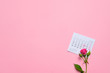 © Stanislav - single rose flower lying on calendar page showing february 2020, valentin, valentine card concept, calendar, pink background, flatlay, copyspace, blank