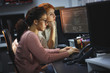 © BalanceFormCreative - Two female programmers working on new project.They working late at night at the office.