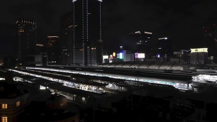 Canvas Print - 4K Time lapse of train moving in Tokyo Station, Tokyo, Japan. Tokyo skytrain timlapse in night time at Main station Area. Tokyo night city landscape.