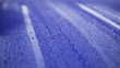 Closeup blue car paint surface with hydrophobic ceramic coating