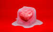 abstract 3d illustration of warm heart in the melting big ice cube on red background
