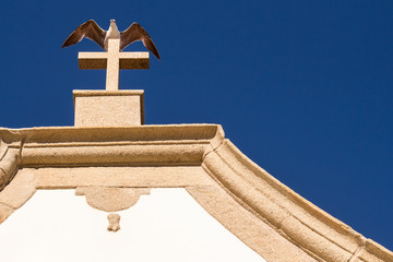 Roof with a cross and a seagull