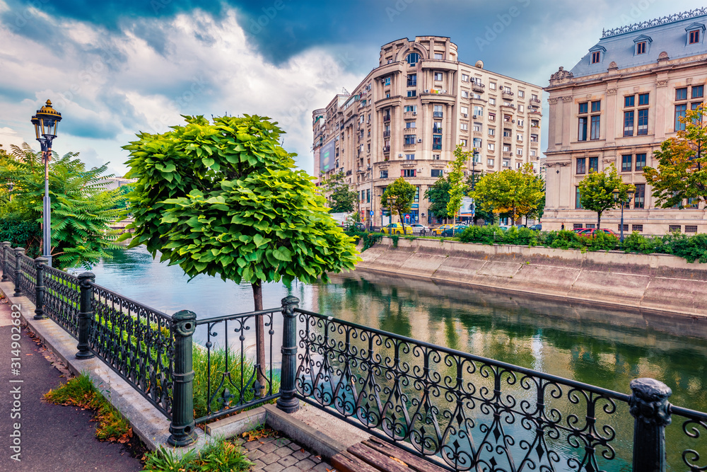 Obraz na płótnie Beautiful morning cityscape of Bucharest city - capital of Romania, Europe. Splendid  summer view of Dambovita River. Traveling concept background. w salonie