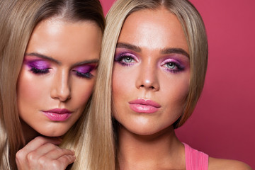 Wall Mural - Two girls. Beautiful women faces close up portrait