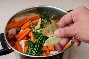 Wall Mural - Chef at work: How to make a broth