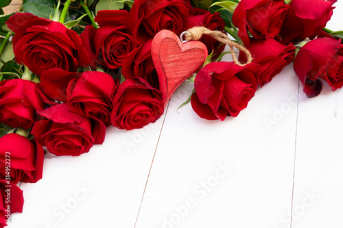 Red blooming roses on wood