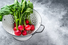 Fresh Garden Radish In A White Colander. Farm Organic Vegetables. Gray Background. Top View. Space For Text.