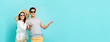 © Atstock Productions - Happy couple in summer beach casual clothes on light blue banner background