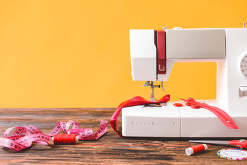 Sewing machine with supplies on table