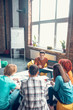 © zinkevych - Students sitting in cozy work hub and preparing for group project