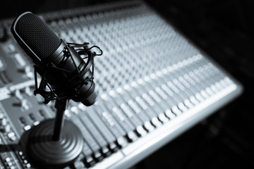 condenser microphone on audio mixing console