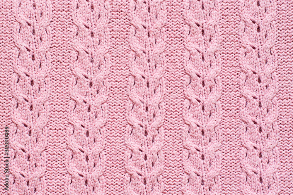 Foto Cable lace knitting stitch pattern, soft pink woolen texture