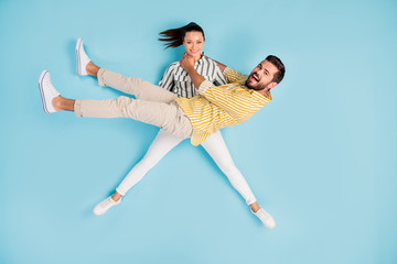 Canvas Print - Top view above high angle flat lay flatlay lie concept full length body size view of nice crazy girl carrying guy having fun isolated on bright vivid shine vibrant blue turquoise color background