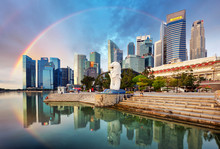 SINGAPORE - OCTOBER 11: Singapore - Merlion Fountain With Rainbow In Front Of The Marina Bay Sands Hotel At Sunrise