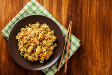 Fried Rice Nasi Goreng With Chicken And Vegetables On A Plate