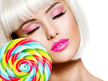 Face Of A Beautiful  Girl With Pink Make-up And Multicolor Sweet Candy.