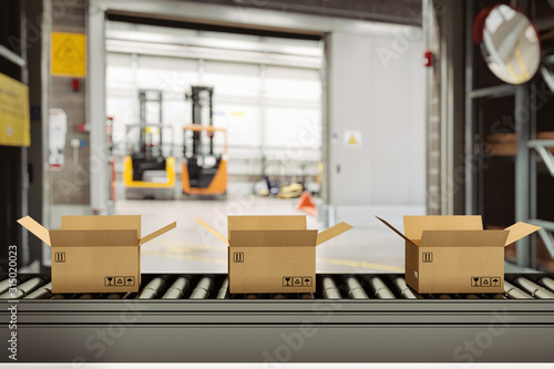 Cuadros en Lienzo Cardboard boxes on conveyor rollers inside a warehouse ready to be shipped by co